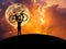 Silhouette the man lifting bicycle above his head in sunset with full moon