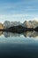 Silhouette of Man, Mountains and Reflection in Lac Blanc Lake at Sunset. Golden Hour. French Alps, France.