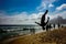 Silhouette of the man perfoming a back somersault in pike position at Ipanema beach, Rio de Janeiro, Brazil