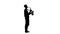 Silhouette of a man playing the saxophone standing sideways