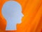 silhouette of a man& x27;s head with a luminous orange background, suitable for creating endless content