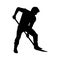 Silhouette of a man with a shovel digs soil. Farmer or gardener planting in the garden or