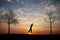 Silhouette of man on slackline