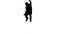 Silhouette of a man spinning as he jumps in slow motion
