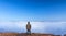 Silhouette of man standing on a high hill scenic rural hometown