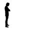 Silhouette of man standing pensive