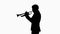 Silhouette Man in suit standing playing trumpet.