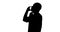 Silhouette of man talking on mobile phone