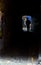 Silhouette Man Walking in Dark Alley