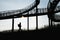 Silhouette of a man walking next to the Tiger and Turtle Ã¢Â€Â“ Magic Mountain, Duisburg Germany