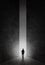 Silhouette of man walking through a passageway through the universe