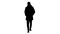 Silhouette Man in warm coat walking and putting on medical mask.