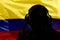 Silhouette of a man wearing headphones on the background of the flag of Colombia, eavesdropping on a conversation, secret agent, m