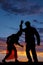 Silhouette man woman facing each other elbow on head