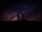 Silhouette of man and woman over grass and hill with star milky way backgrounds, romantic valentine