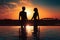 Silhouette of a man and woman standing in the pool at sunset, Silhouette of man and woman standing in swimming pool at beautiful