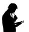 Silhouette of man writing business diary