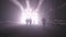 Silhouette of many construction workers walking out from a large tunnel