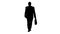 Silhouette Mature businessman walking in a hurry and looking at watch.