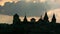Silhouette of medieval fortification castle Kamianets-Podilskyi on sunset