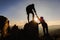 Silhouette of The men helping pull people up from high cliffs