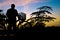 Silhouette Middle-aged man exercise by bicycle in twilight time