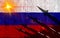 Silhouette of missiles against the background of the flag of Russia and lightning in the background. Symbolizes aggression