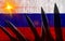 Silhouette of missiles against the background of the flag of Russia and lightning in the background. Symbolizes aggression