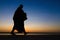 Silhouette of monk feet walking on concrete ground for people of