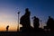 Silhouette of monk feet walking on concrete ground for people of