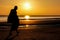 Silhouette of monk walk on the beach , Huahin