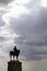 Silhouette of monument of Ataturk with cloudy sky and sunrays between the clouds