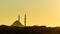 Silhouette of a Mosque Fatih in a fog and sunlight reflections. Vintage style.