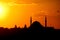 Silhouette of a mosque minaret at sunset