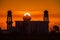 A silhouette of a mosque at sunrise vivid color