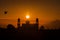 A silhouette of a mosque at sunrise vivid color