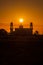 A silhouette of a mosque at sunrise vivid color , Thailand