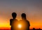 Silhouette of Mother and Son Watched Together at Sunset Evening Sky Background, Life and Happiness family Concept