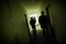 Silhouette Motion Blur Men In Dark Corridor