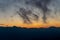 Silhouette mountains against sky at sunset