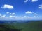 Silhouette of mountains in Bulgaria in summer and many white clouds in the blue sky. Mountainous view.