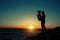 Silhouette of musician with tuba on the beach