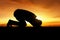 Silhouette of muslim man praying