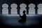 Silhouette of muslim man praying