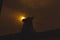 Silhouette of Nandi idol during sunset in the background