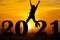 Silhouette and New year sunset background. Woman standing and show hand