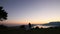 Silhouette of a newlywed couple in the mountains at sunset. Wedd