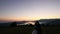 Silhouette of a newlywed couple in the mountains at sunset. Wedd