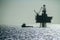 Silhouette of an Offshore Supply Vessel alongside oil platform Ringhorn in the North Sea