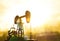 Silhouette of an oil drilling pump against a background